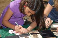 Girl making card with Polynesian designs