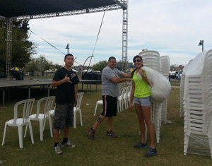 Volunteers setting up chairs