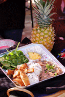 Picture of 'plate lunch' with pineapple beside it